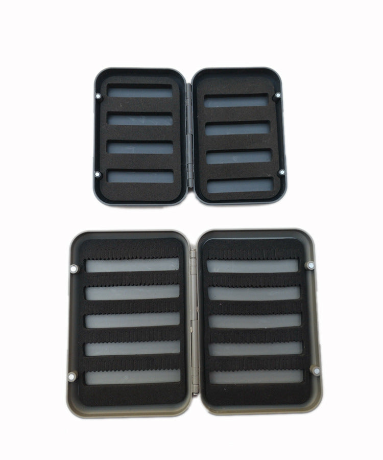 Small and large fly boxes open for a layout comparison