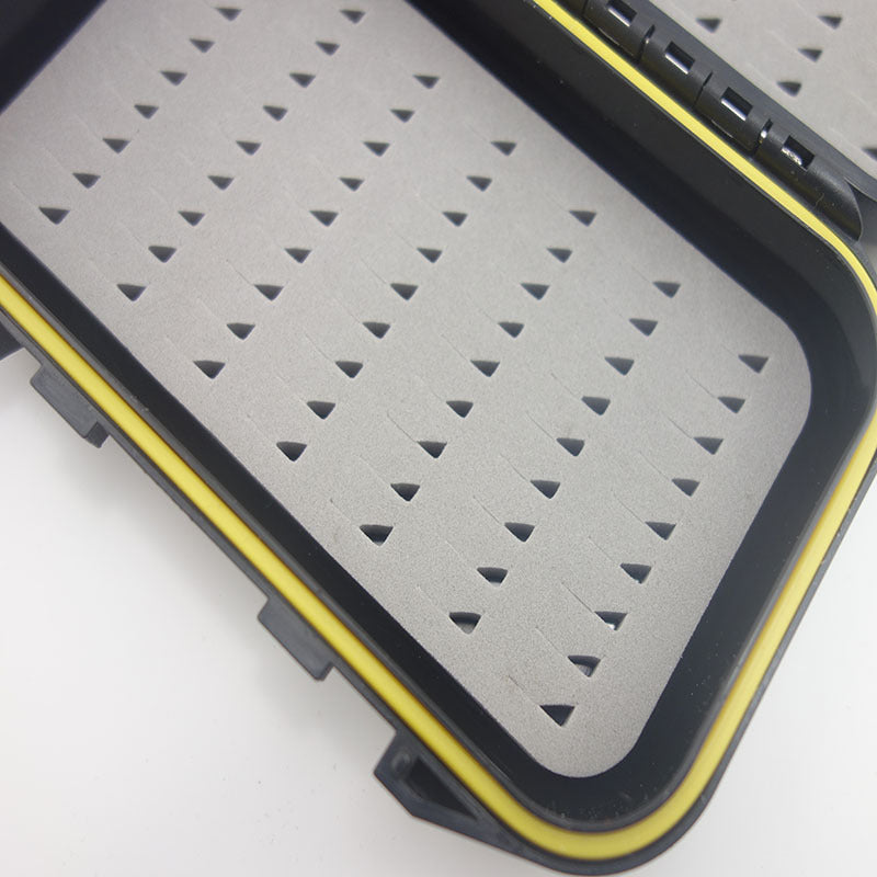 Close-up of slit foam and yellow perimeter gasket