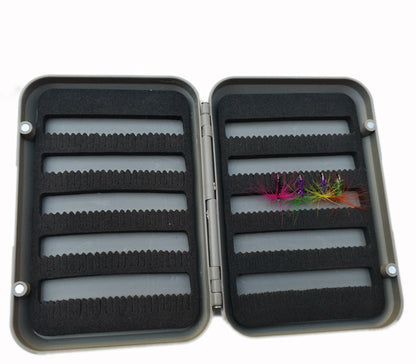 Open large fly box showing foam rows with flies as examples