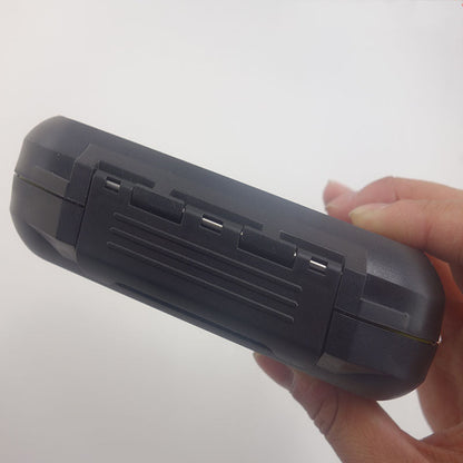 Hand holding the closed fly box to show its compact profile