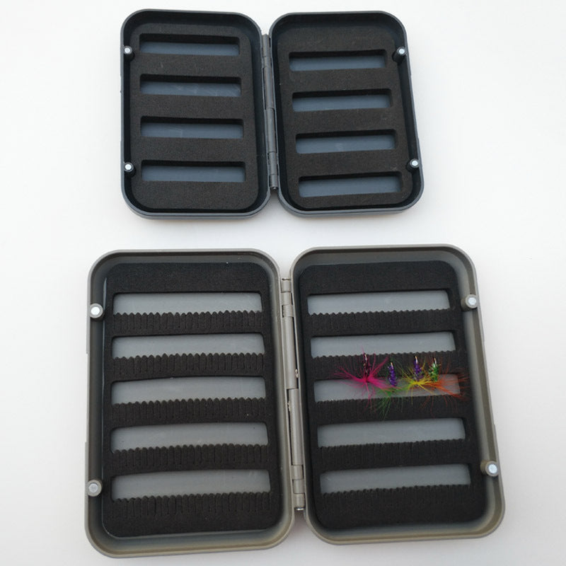 Open small and large fly boxes showing different foam layouts