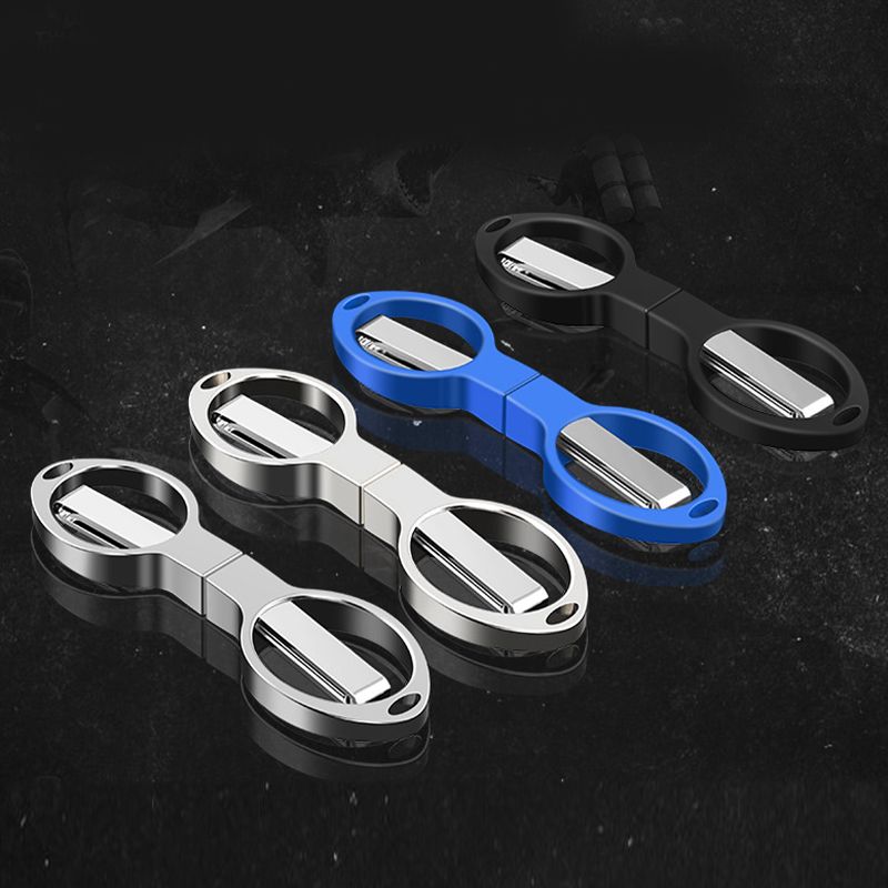 Silver, blue, and black folding scissors in closed positions