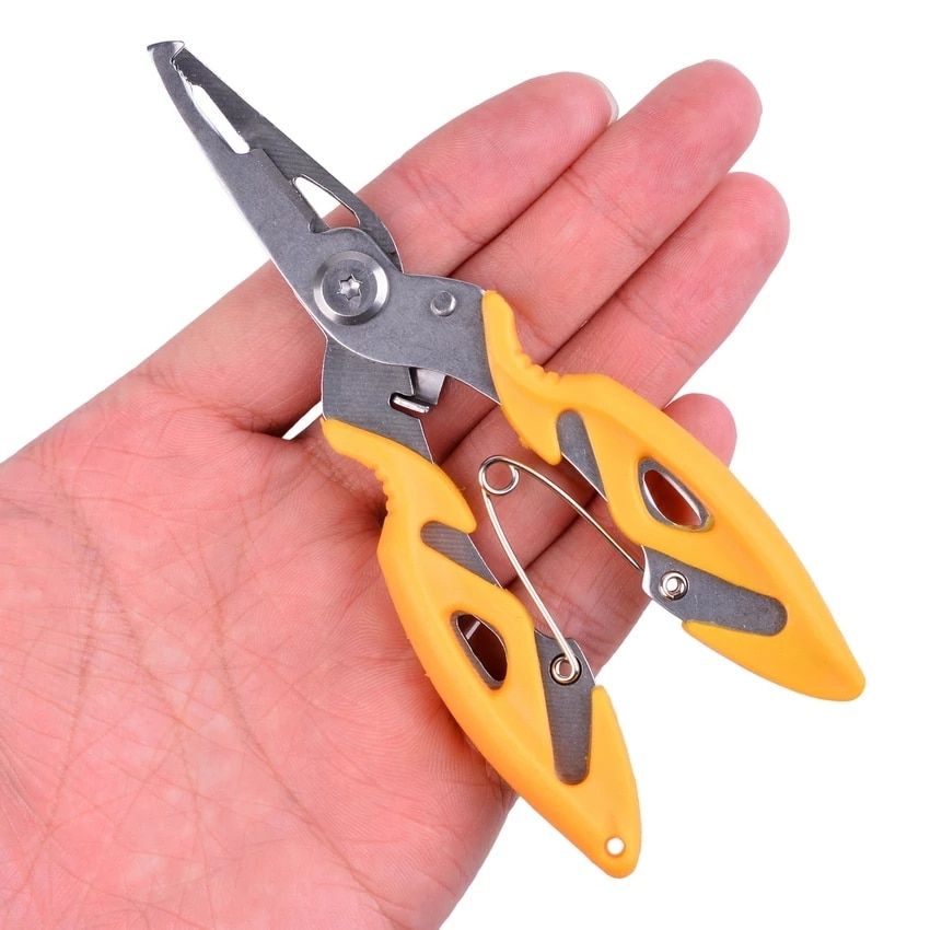 Hand holding yellow-handled fishing pliers to show their size